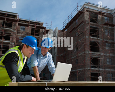 Engineers with laptop Stock Photo