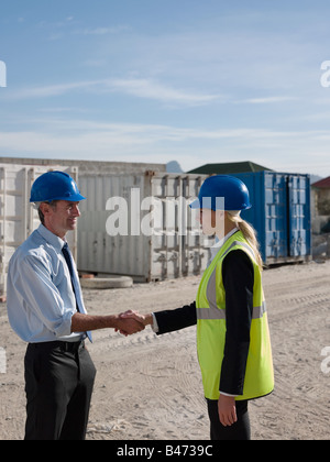 Engineers shaking hands Stock Photo