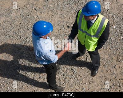 Engineers shaking hands Stock Photo