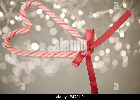 Candy canes in heart shape Stock Photo