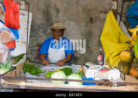 Man at his produce post Penonome Public Market, Province of Cocle, Republic of Panama, Central America Stock Photo