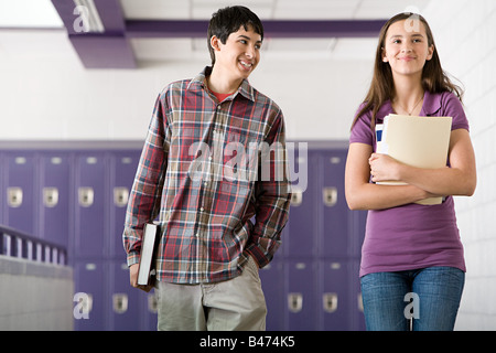 High school students walking down a corridor Stock Photo
