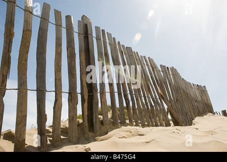 Fence on a beach Stock Photo