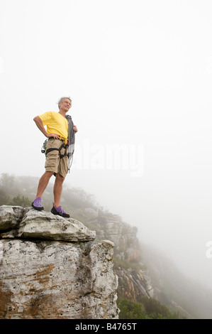 Man standing on a rock Stock Photo