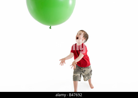 A boy playing with a balloon Stock Photo