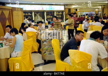 People have Cantonese Dim Sum with tea in a restaurant in Dongguan, Guangdong, China. 20-Sep-2008 Stock Photo