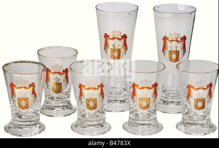 Seven glasses, Kingdom of Serbia, end of the 19th century. Two large and five small glass goblets, each with a gilded rim and the great coat of arms for the Kingdom of Serbia on the front. Gilding is slightly abraded. Heights 15.5 and 9.5 cm, respectively. The great coat of arms was shown in this form between 1882 and 1918 and served as a pattern for the coat of arms, which from 2004, has been adopted by the modern nation of Serbia. historic, historical, 1910s, 20th century, 19th century, vessel, vessels, object, objects, stills, clipping, clippings, cut out, c, Stock Photo