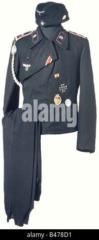 A black Panzer Troop uniform, orders and citations for Feldwebel Herbert Fichter of the 1st Panzer Regiment. Enlisted man's black wool field cap, grey green cotton lining with maker's stamp and size stamp '58', woven BeVo insignia, aluminum oak leaf on the side for the members of the 1st Panzer Division. Black wool panzer jacket, bro historic, historical, 1930s, 1930s, 20th century, armoured corps, armored corps, tank force, tank forces, branch of service, branches of service, armed service, armed services, military, militaria, utensil, piece of equipment, uten, Stock Photo