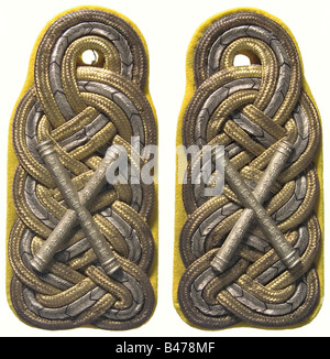 Field Marshal Paul von Hindenburg., A pair of shoulder boards for a Field Marshal and detached officer of the 3rd Foot Guards Regiment. Large gold/silver mesh on yellow backing with pinned silver marshal's batons. Hindenburg wore these shoulderboards during the Battle of Tannenberg. There are visible traces of the three rank stars which he wore up to 27 November 1914, and which were removed. There is also a hand written instruction from 1920 for the alteration of an overcoat, as well as a sworn statement from the tailor who did the alterations, that these are t, Stock Photo