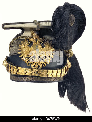A czapka for Rittmeister, of the Uhlan Regiment No. 4, according to the regulation of 1878. White cover, fire-gilt fittings, chinscales consists of combined links, emblem with attached '4', black horsehair plume, chain on gilt lion's head mounts, golden border with black interlaces. White silk liner, brown leather sweatband. Rare and early czapka. historic, historical, 19th century, Imperial, Austria, Austrian, Danube Monarchy, Empire, object, objects, stills, clipping, clippings, cut out, cut-out, cut-outs, uniform, uniforms, piece of clothing, clothes, outfit, Stock Photo