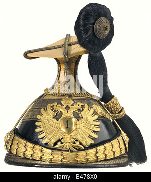 A czapka for Rittmeister, of the Uhlan Regiment No. 1. Yellow cover, fire-gilt fittings, chin chain consists of combined links, plate with punched out '1', black horsehair plume, gilt chain on gilt lion's head mounts, golden border with black interlaces. White silk liner, brown leather sweatband. historic, historical, 19th century, Imperial, Austria, Austrian, Danube Monarchy, Empire, object, objects, stills, clipping, clippings, cut out, cut-out, cut-outs, uniform, uniforms, piece of clothing, clothes, outfit, outfits, helmet, helmets, cap, caps, headpiece, he, Stock Photo