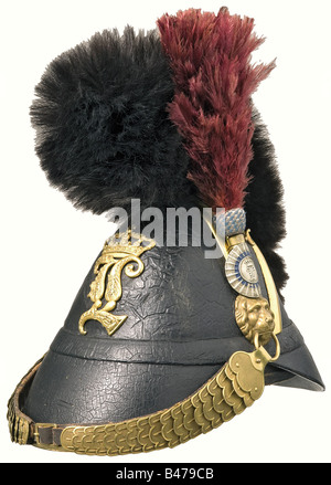 A model 1848/64 artillery officer's helmet., A leather helmet of M 1845 pattern with a replacement 'L' plate, guard bars and officer's cockade. Original bearskin crest and ostrich feather plume with a blue-silver embroidered base. Sheepskin lining. Lacquer is somewhat scarred, otherwise in undisturbed condition. historic, historical, 19th century, Bavaria, Bavarian, German, Germany, Southern Germany, the South of Germany, object, objects, stills, militaria, clipping, cut out, cut-out, cut-outs, helmet, helmets, headpiece, headpieces, utensil, piece of equipment, Stock Photo
