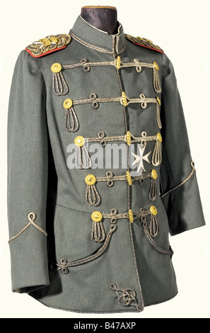 Kaiser Wilhelm II, an interim field grey attila for the Hussar Life Guards Regiment Fine, field grey cloth, with cord fastenings of interwoven flat cords of silver and black (unevenly darkened), golden rosettes and toggle. Field grey silk lining (several rips due to age). Label with an embroidered, crowned 'W' and 'Leib-Grd. Hus. Rgt. 16'. Sleeved epaulets with silver marshall's batons and golden ciphers. Sewn-on neck cloth with the order ribbon of the Pour le mérite with oak leaves. Order loops and a fabric cross for the Order of St. John. The left sleeve of t, Stock Photo