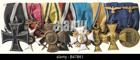 An eight-piece medal group, for a Württemberg officer Iron Cross 1914, 2nd Class, iron, silver (OEK 1909). Order of the Württemberg Crown, Knight's Cross with Swords 1870 - 1918, gold and enamelled with a small chip in the medallion ring (OEK 2940). Wilhelm Cross with Swords, bronze (OEK 3078). Cross of Honour for combatants. Friedrich Order Knight's Cross 1st Class, gold and enamelled (OEK 2980). 25 Years Long Service Awarda 1st Class for officers and men, 1891 - 1921, gilded bronze, enamelled green wreath (OEK 3089). Wehrmacht Service Insignia, Cross 1st Clas, Stock Photo