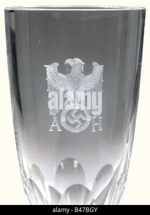 Adolf Hitler, six champagne glasses from his table service Heavy lead crystal with stems cut in facets and round, cambered bases. There is a standing eagle above the swastika with the monogram A.H.' cut into the obverse sides. The rim of one glass is slightly damaged. Heights 17.5 cm. Only a very small number of glasses have been preserved from Hitler's personal table service. See a set of four glasses for wine, champagne, and liqueur in Hermann Historica's 29th auction, 21 to 23, October 1993, lots 4982 to 4985. A wine glass from Hitler' special train, in Herm, Stock Photo