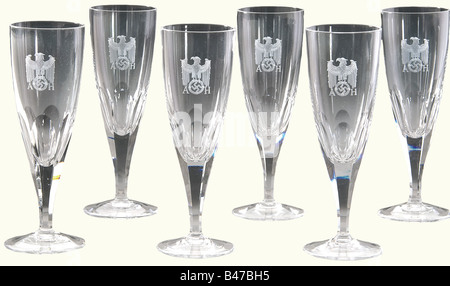 Adolf Hitler, six champagne glasses from his table service Heavy lead crystal with stems cut in facets and round, cambered bases. There is a standing eagle above the swastika with the monogram A.H.' cut into the obverse sides. The rim of one glass is slightly damaged. Heights 17.5 cm. Only a very small number of glasses have been preserved from Hitler's personal table service. See a set of four glasses for wine, champagne, and liqueur in Hermann Historica's 29th auction, 21 to 23, October 1993, lots 4982 to 4985. A wine glass from Hitler' special train, in Herm, Stock Photo