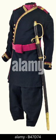 A children's uniform in the rank of a sergeant, of the 4th Tirailleurs de la Garde ('de la Famille Impériale'). A half caftan 'à la Russe' made of very fine black cloth with crimson red pipings. The gold lace interwoven in red reaching from the collar to the hip (as worn only between 1906 and 1908). Golden double-eagle buttons with golden cord loops. The sleeve lapels with guard's braids. Onsewn shoulder boards. Crimson-red and black silk lining. Trousers en suite with blued and partly gilt fittings and buttons 'Ideal'. In very fine state of p historic, histori, Stock Photo