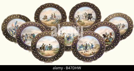 Napoleon I - nine Sèvres plates, between 1804 and 1814. Each plate adorned in the centre with an extremely elaborate painting of one of Bonaparte's famous battles, on the border a stencilled pattern in gold on the famous 'bleu des Sèvres'. On the back the name of the battle and a stencilled red manufacturer's mark. Diameter each 24 cm. Each plate shows a scene from the following events and is accordingly marked on the back: 'Toulon' (1793), 'Pont S'Arcole' (1798), 'Zurich' (1799), 'Passage de la Linz' (1800), 'Austerlitz' (1805), 'Eylau' (1807), 'Wagram' (1809), Stock Photo