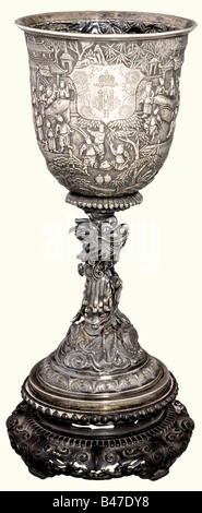 Count Friedrich-Werner von der Schulenburg - a silver goblet, once the possession of Tsar Nicholas II and his wife Alexandra Fiodorovna. The goblet is embossed, chiseled, and engraved. Chinese export marks for approx. 1900. Surface completely ornamented with illustrations of battle scenes and court life. There is a shield-shaped field on the obverse side bearing the crowned monograms of the ruling pair 'N II' and 'A'. The stem is in the shape of an ascending, twisting lucky dragon. The openwork, carved base is of high quality wood. Height 35 cm. Weight with bas, Stock Photo
