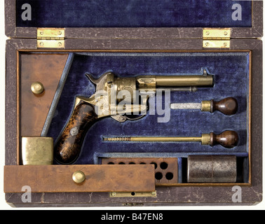 A cased bronze pinfire revolver, Liege, circa 1865. 7.5 mm Lefaucheux calibre. No number. Barrel and frame made of bronze. Round barrel, six-shot cylinder. Folding trigger. Cylinder, frame, and barrel base have finely engraved rocaille ornamentation. The grip panels are made of Thuja root-wood. The iron pieces are lightly pitted in places. Length 18 cm. In a wooden case lined with blue velvet and containing accessories. The exterior is decorated with marquetry. The corners are light bone. Key missing. Dimensions 29 x 19 x 8.5 cm. Erwerbsscheinpflichtig. histori, Stock Photo