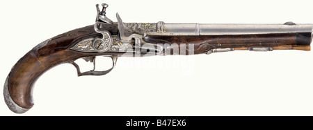 A flintlock hunting pistol, German, circa 1760. Round, three-stage barrel with a smooth bore in 12 mm calibre. There is a engraved picture of a stag amid decorative rocaille on top of the chamber. Richly chiselled lock. Lightly carved walnut stock with horn nose cap. The entire surface of all the iron furniture is cut with depictions of numerous wild animals amid decorative rocaille, the background showing remnants of gilding. Wooden ramrod with horn tip. Length 36 cm. historic, historical, 18th century, civil handgun, civil handguns, handheld, gun, guns, firea, Stock Photo