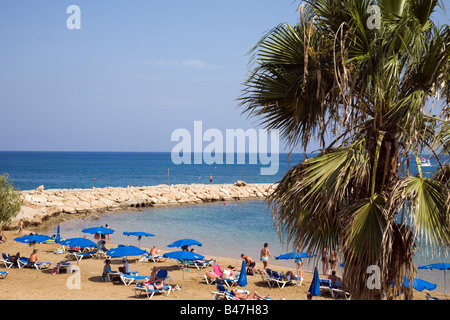 VIEW OF PERNERA BEACH NEAR PARALIMNI, PROTARAS, IN CYPRUS WITH  UMBRELLAS AND GOLDEN SAND Stock Photo