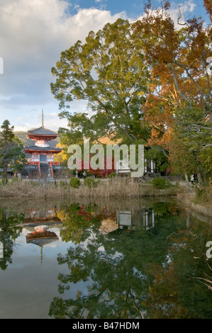 Japan Kyoto Arashiayama Daikaku ji temple Osawa no ike Pond view of Pagoda reflected into water Stock Photo