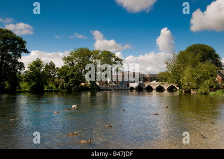 Looking across the River Avon towards famous historic arched bridge, Fordingbridge, Hampshire, England, UK Stock Photo