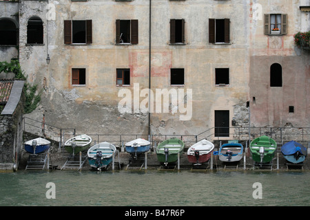 Boats ashore by Lake Lugano, Switzerland Stock Photo