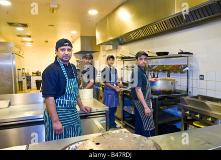 Kitchen staff in the kitchens at an Indian Restaurant in the UK Stock Photo
