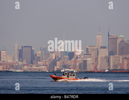 US Coast Guard patrolling New York Harbor Stock Photo