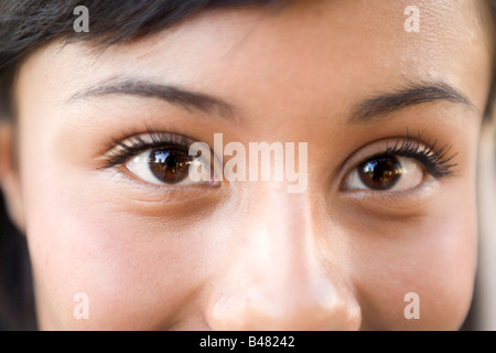closeup of fifteen year old hispanic teenager looking at camera, girl, woman, latina latino southwestern united states Stock Photo
