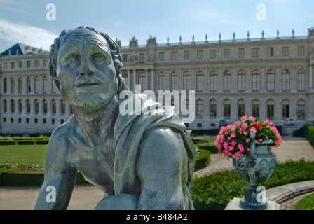 Statue and planter in front of the Palace of Versailles, near Paris, France. Stock Photo