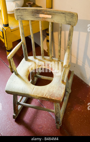 19th century child's rocking chair and commode (american) seen in museum in Chatham, Massachusetts Stock Photo