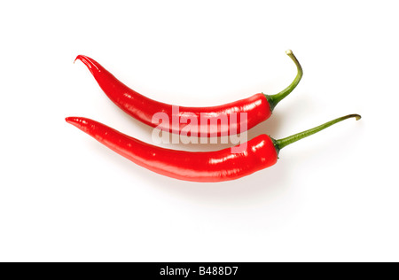 Isolated shot of red hot chilli peppers on white background Stock Photo