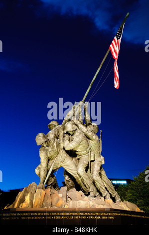 ARLINGTON, Virginia, United States — The Iwo Jima Memorial, also known as the Marine Corps War Memorial, stands tall in Arlington, Virginia, depicting the iconic scene of six US Marines raising the American flag during the Battle of Iwo Jima in World War II. The memorial serves as a symbol of honor and sacrifice made by the United States Marine Corps. Stock Photo