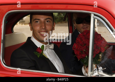 Italian man getting married in Italy inside an original Fiat 600 car Stock Photo