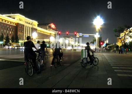 A group of cyclists at night, Tiananmen Square the large city square in the center of Beijing, near the forbidden Palace, China Stock Photo