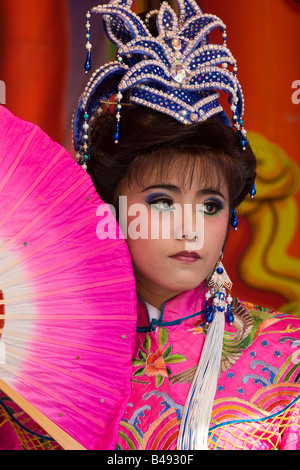Female Taiwanese Chinese opera performer dressed in pink with traditional fan, Changhua, Taiwan, Republic of China (ROC) Stock Photo