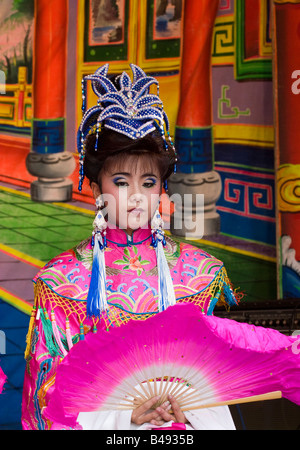 Female Taiwanese Chinese opera performer dressed in pink with traditional fan, Changhua, Taiwan, Republic of China (ROC) Stock Photo