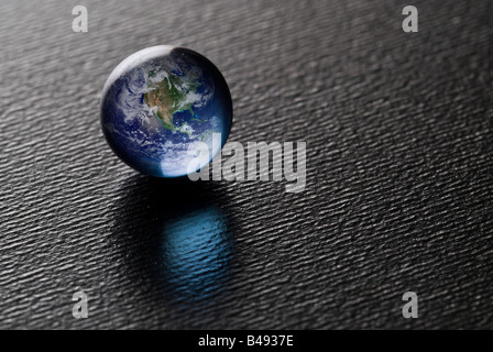A Blue Pearl on black (Credit for the Blue Marble(earth) goes to NASA Image found at http://visibleearth/nasa.gov) Stock Photo
