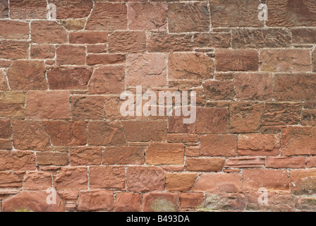 Brick wall made of large slabs of red Scottish stone Stock Photo