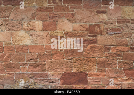 Brick wall made of large slabs of red Scottish stone Stock Photo