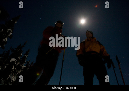 full moon night skiing Stock Photo