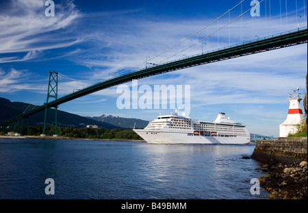 View of the Seven Seas Mariner cruise ship passing under the Lions gate bridge in the port of Vancouver, British Columbia, Canad Stock Photo