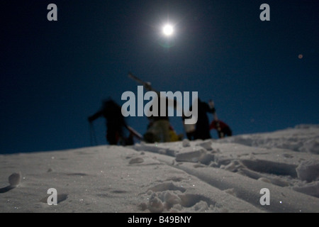 full moon night skiing Stock Photo