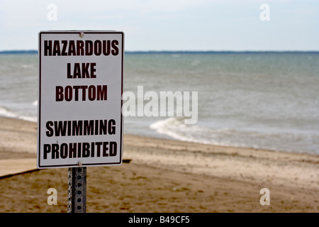 Dangerous lake bottom warning sign at Shades Beach on Lake Erie, Harborcrfeek Township, PA, USA. Stock Photo