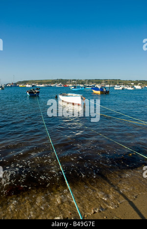 Tethered rowing boats on a perfect evening in Town Bay, Hugh Town, St Mary's, Isles of Scilly Stock Photo