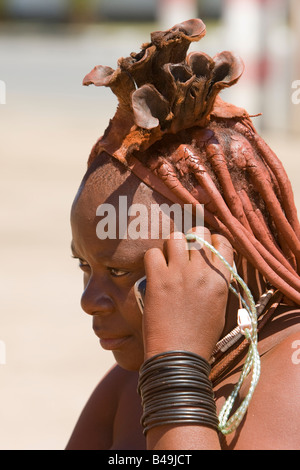Himba woman using mobile phone Stock Photo