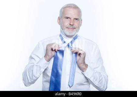 windsor necktie lesson doing by an handsome man Stock Photo